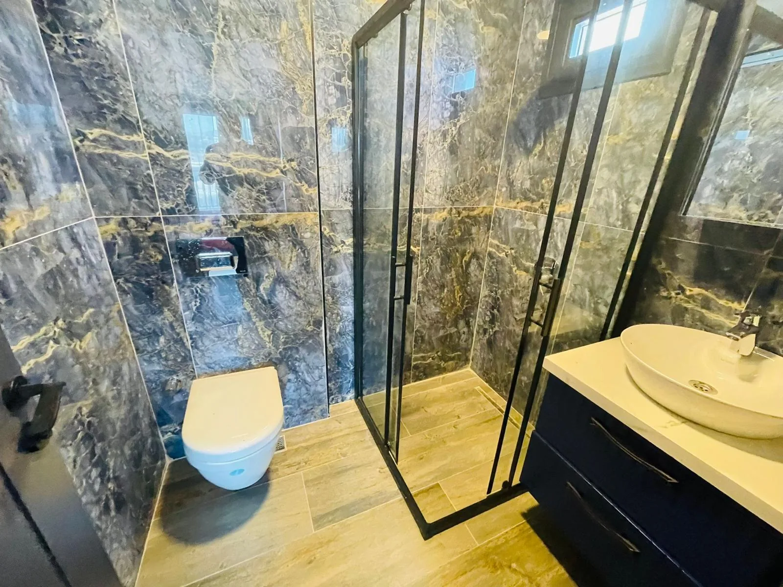 En-suite bathroom with glass shower