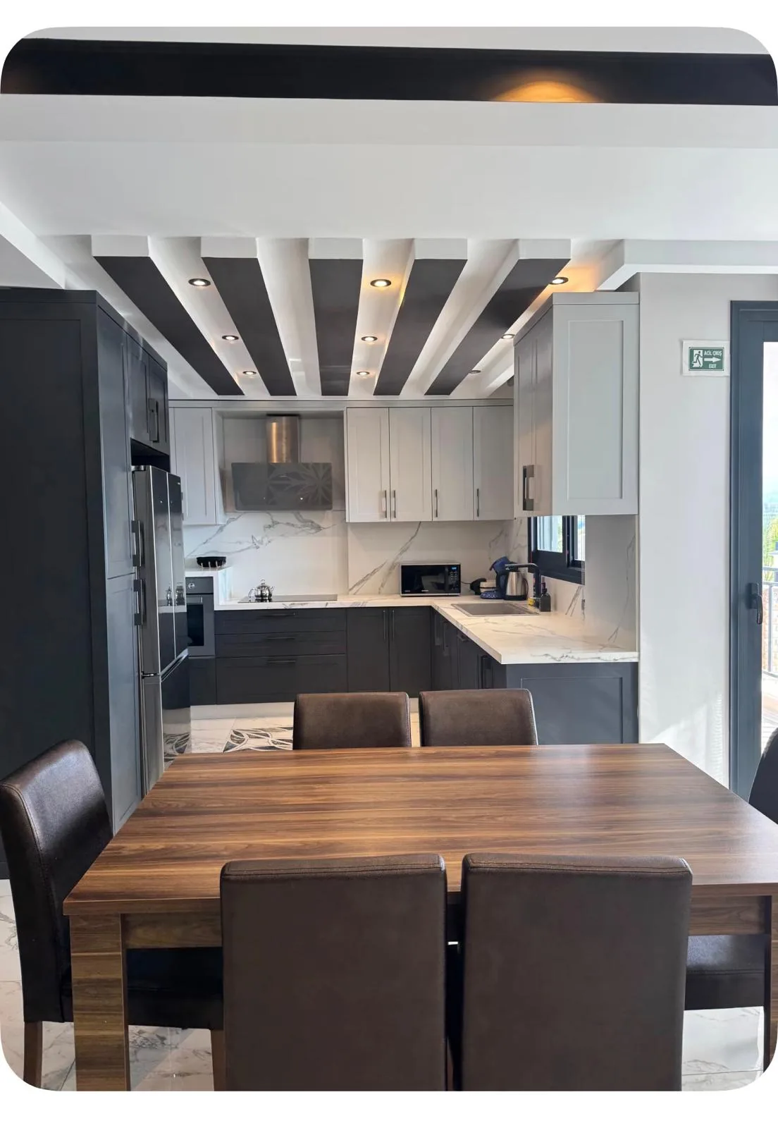 Modern kitchen with dining table